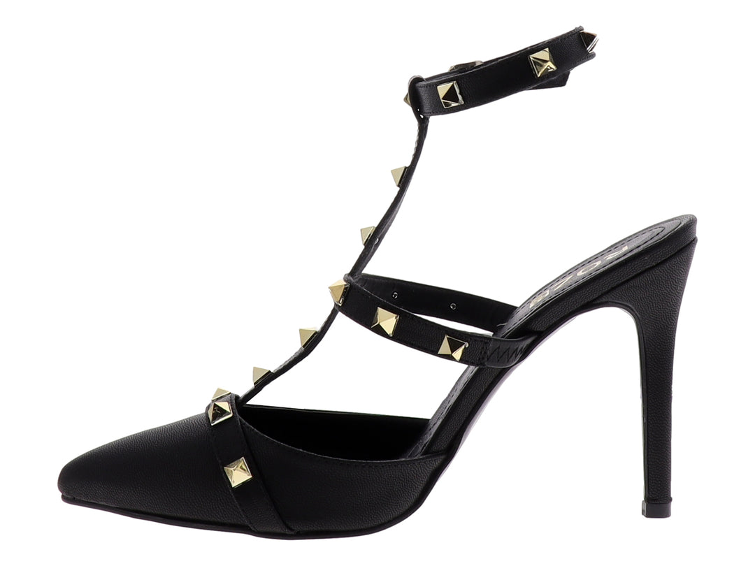 Zapato de tacón negro marca ROZE con punta cerrada, correas decoradas con tachuelas doradas y tacón delgado.
