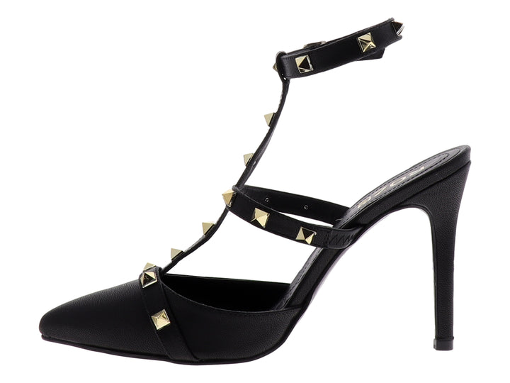 Zapato de tacón negro marca ROZE con punta cerrada, correas decoradas con tachuelas doradas y tacón delgado.