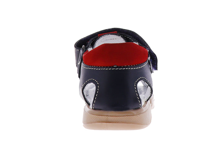 Sandalia para niño marca Coloso color marino con suela blanca y detalles en rojo.