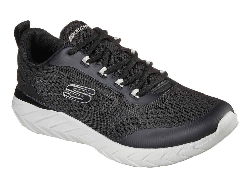 Tenis deportivos Skechers color negro con suela blanca y tejido de malla transpirable.