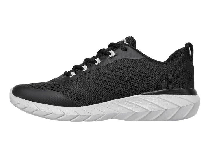 Tenis deportivos Skechers color negro con suela blanca y tejido de malla transpirable.