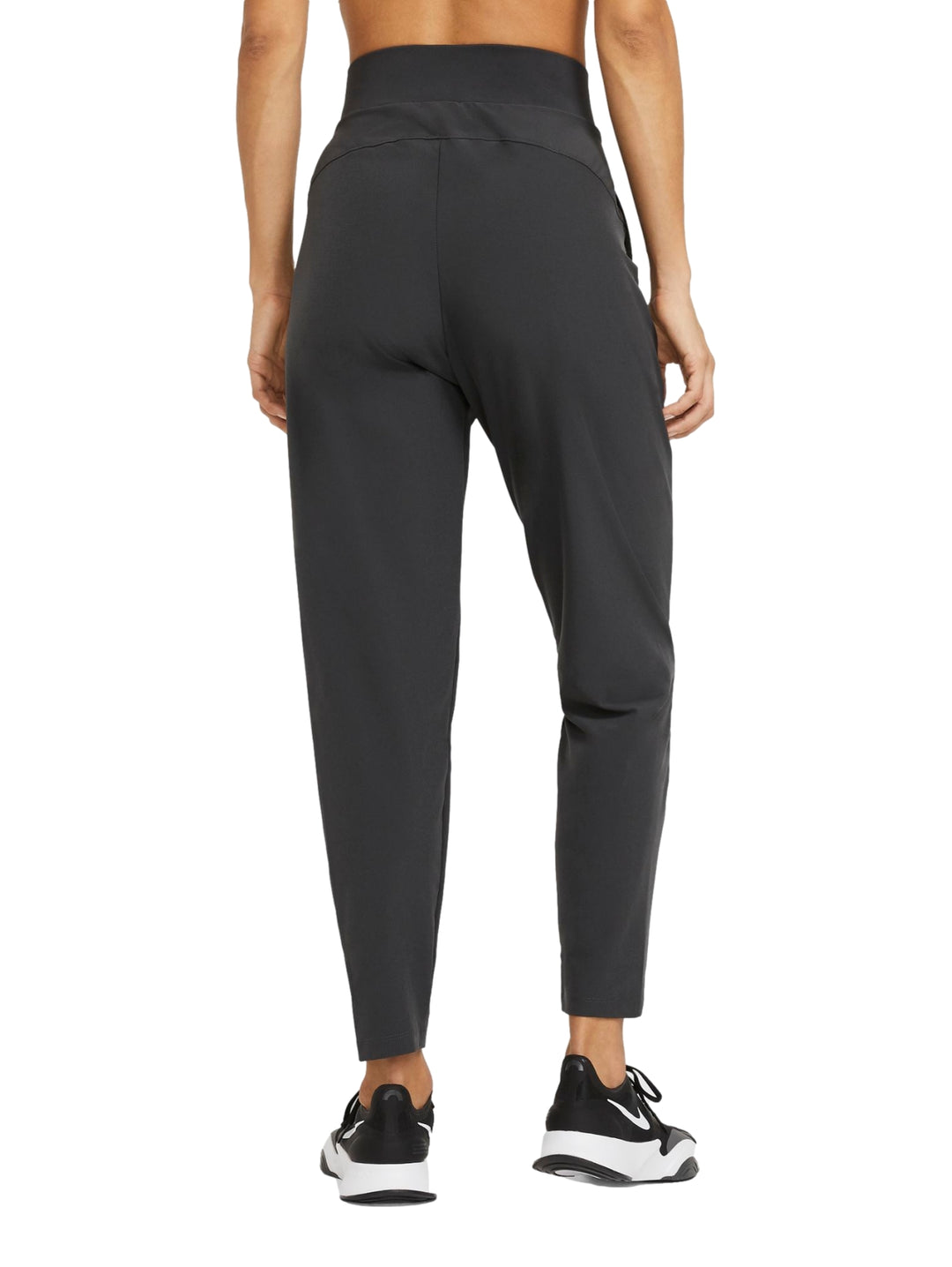 Pantalones deportivos Nike Dri-FIT Bliss en color gris oscuro para mujer.