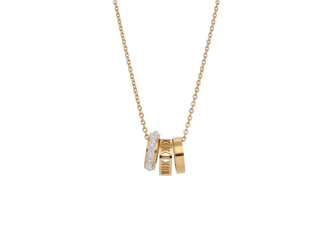 Collar de oro con tres dijes circulares: uno con brillantes, uno con números romanos y uno liso.