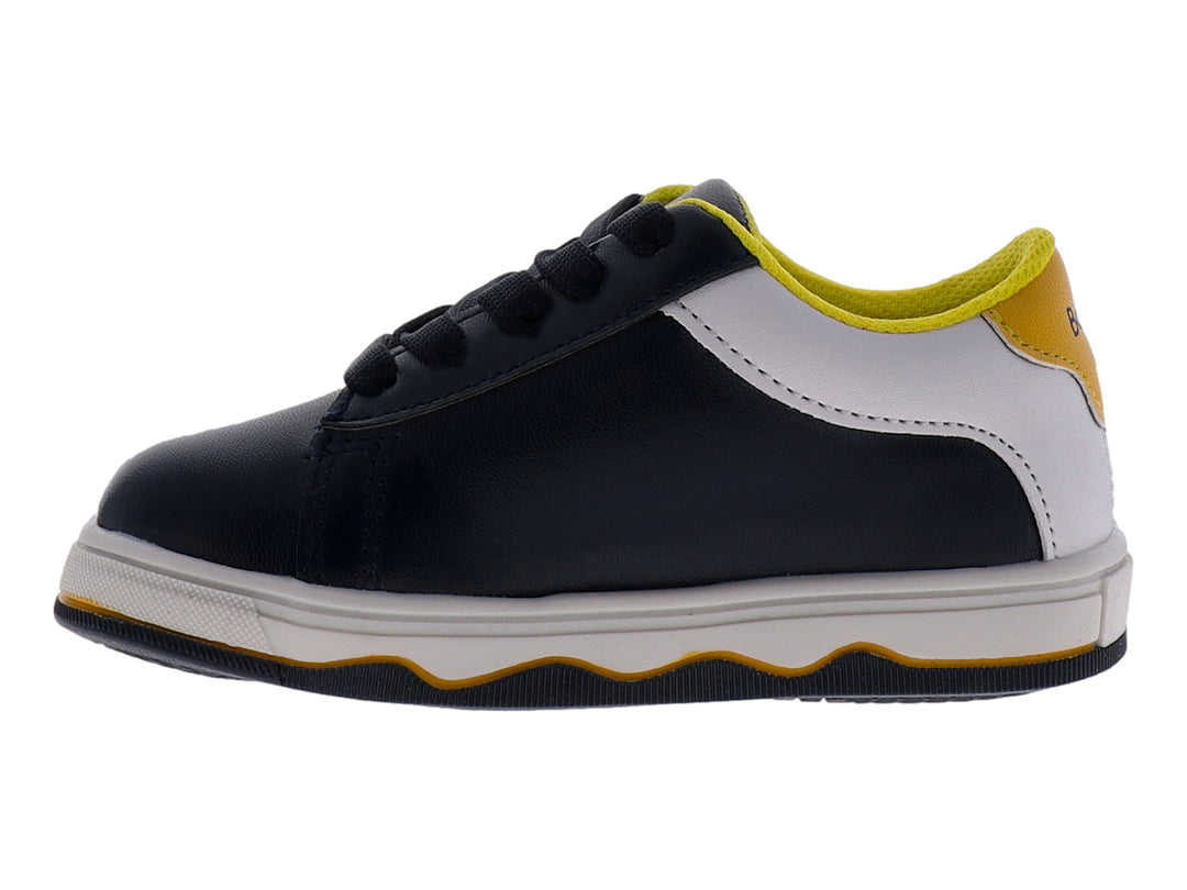 Tenis infantiles color azul marino con suela blanca y detalles en amarillo.