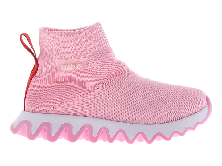 Tenis rosas para niña con tejido elástico y suela blanca dentada.