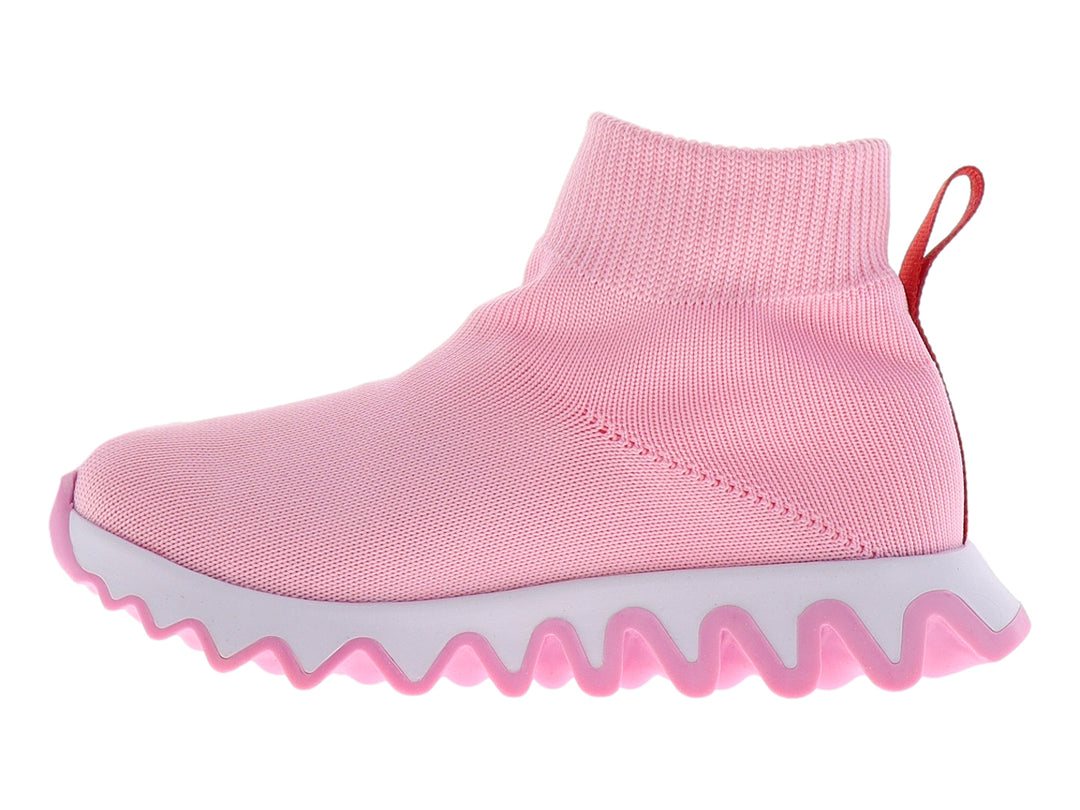 Tenis rosas para niña con tejido elástico y suela blanca dentada.