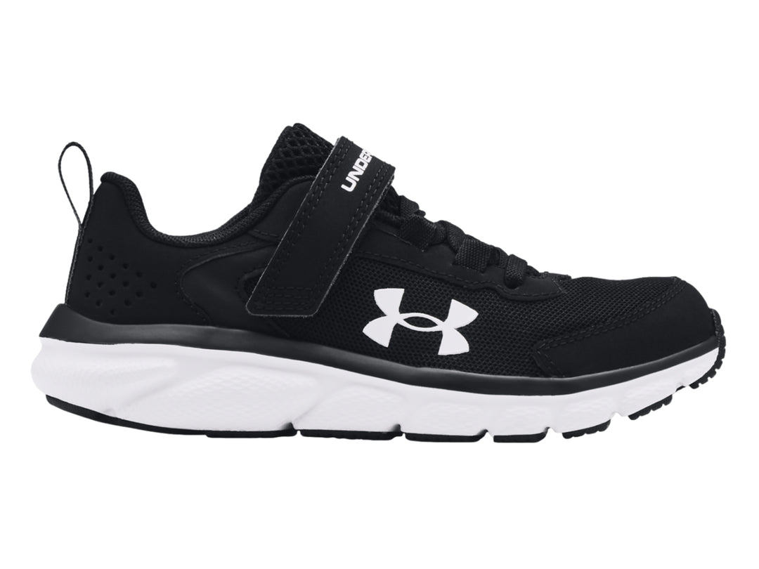 Tenis deportivos Under Armour color negro con suela blanca y correa de ajuste.