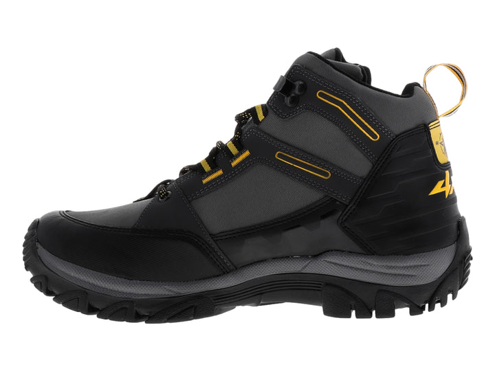 Zapato deportivo tipo botín 4X4 en color negro y gris con detalles amarillos y suela robusta.
