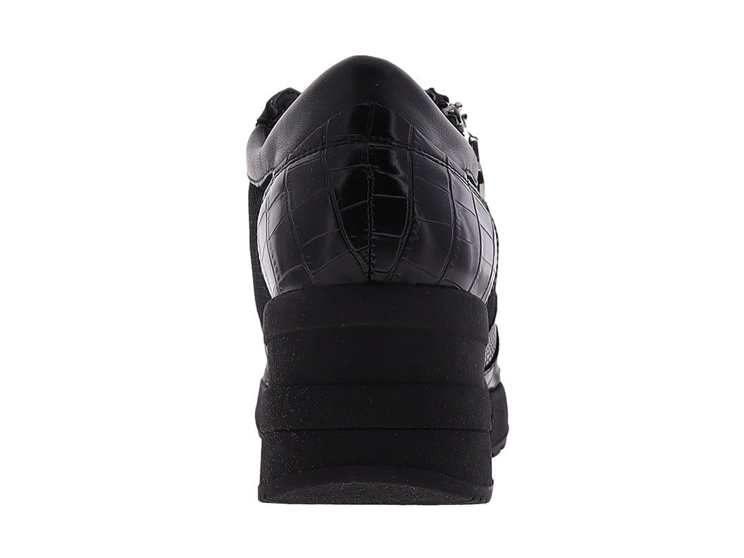 Zapato confort Manet color negro para mujer con plataforma, detalles de malla y textura de cocodrilo.