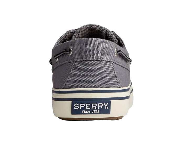 Zapato casual Sperry color gris con suela blanca y detalles en azul marino, estilo náutico.