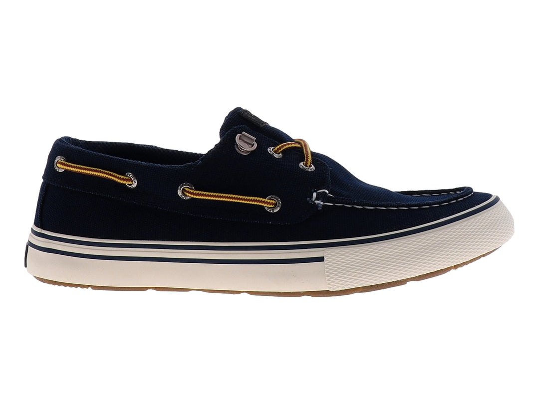Zapato náutico Sperry color azul marino con suela blanca y cordones marrones.