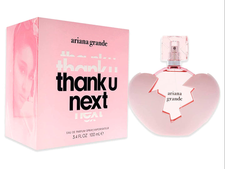 Perfume Ariana Grande Thank U Next en frasco con forma de corazón rosa y su caja correspondiente.
