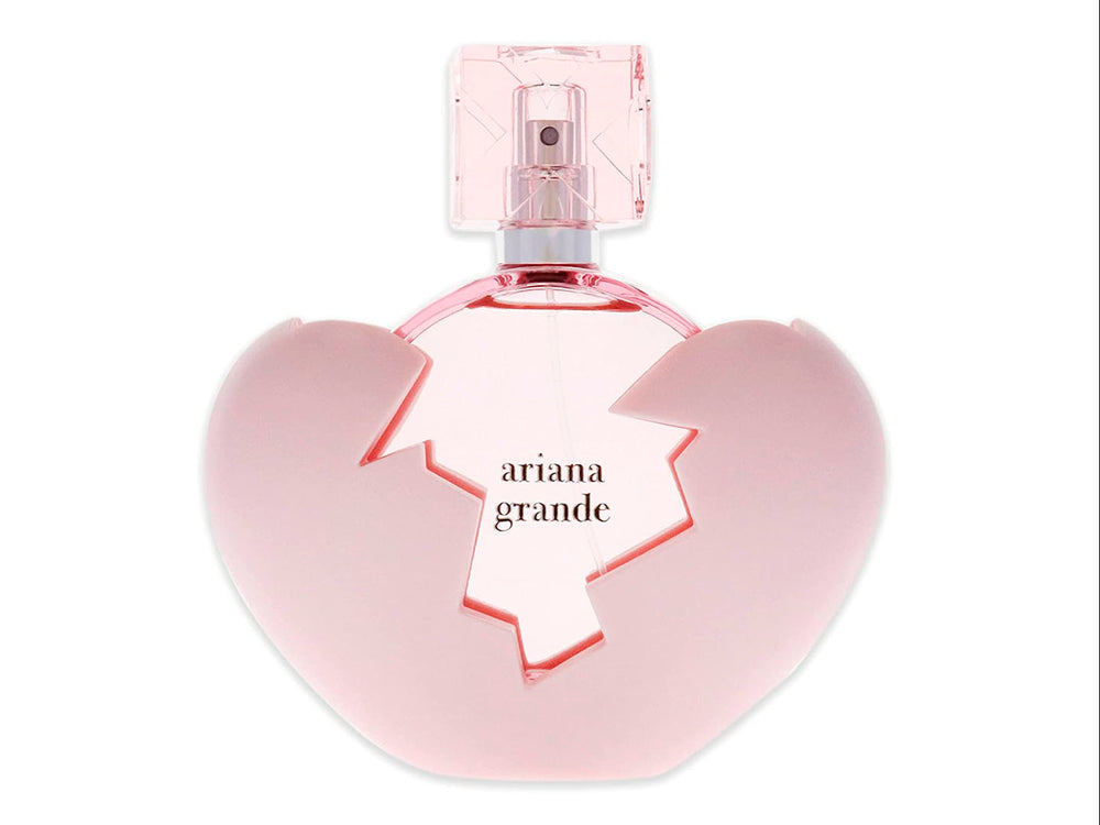 Perfume Ariana Grande Thank U Next en frasco con forma de corazón rosa y su caja correspondiente.