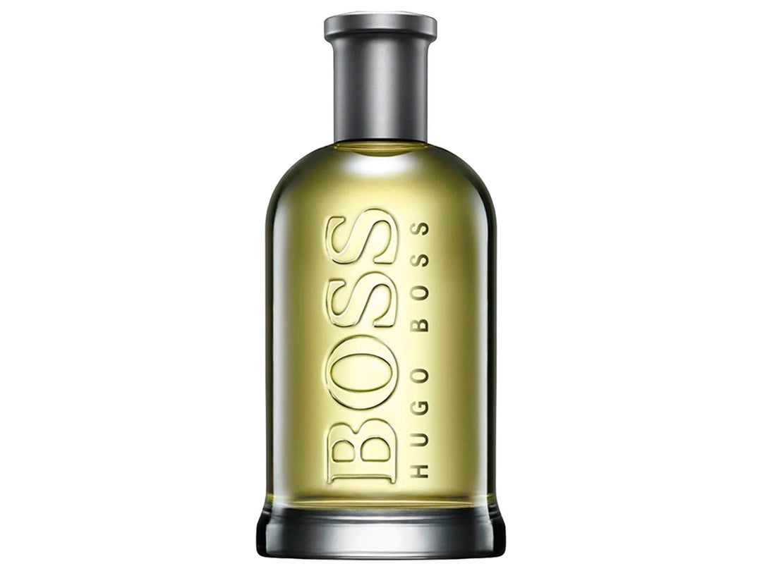Perfume Hugo Boss Bottled en frasco de vidrio con líquido amarillo y su caja gris plateada.