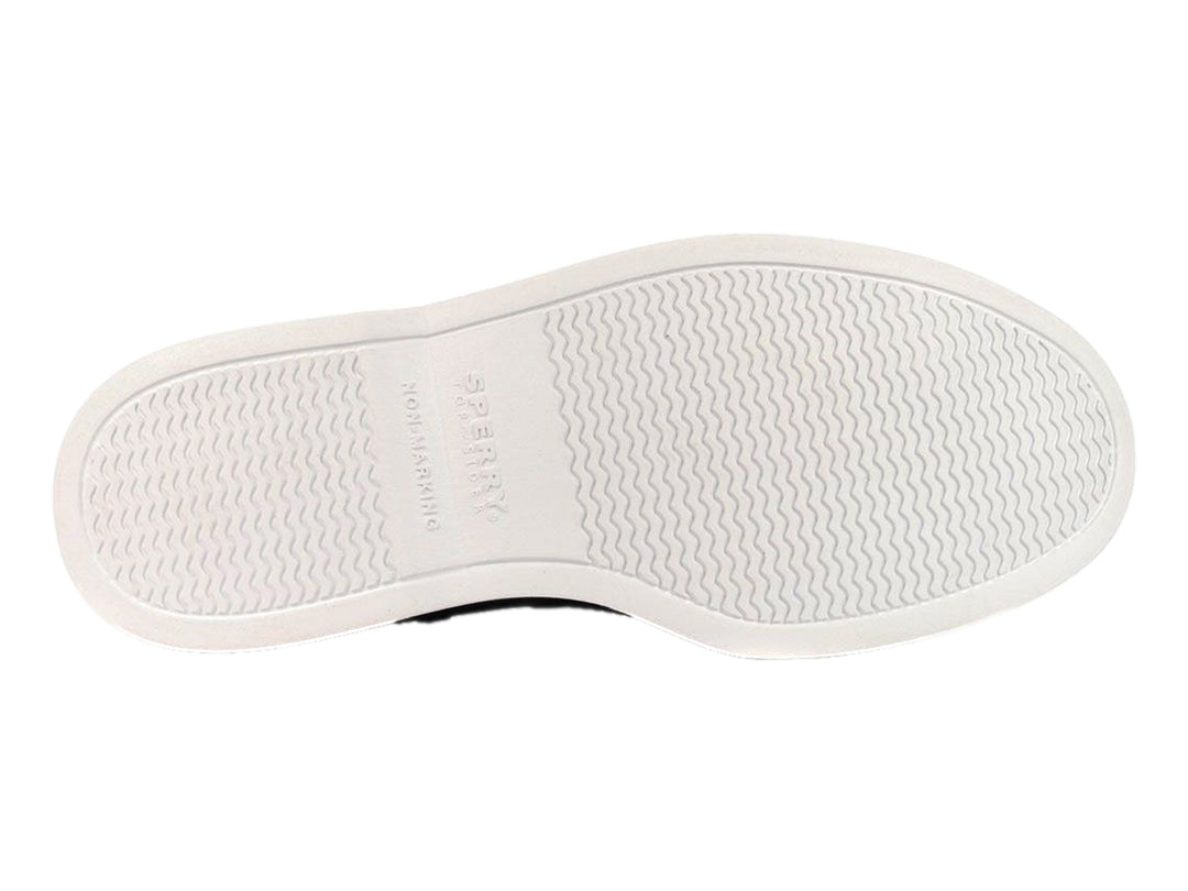 Zapato slip-on Sperry color negro marmoleado con suela blanca y perforaciones laterales.