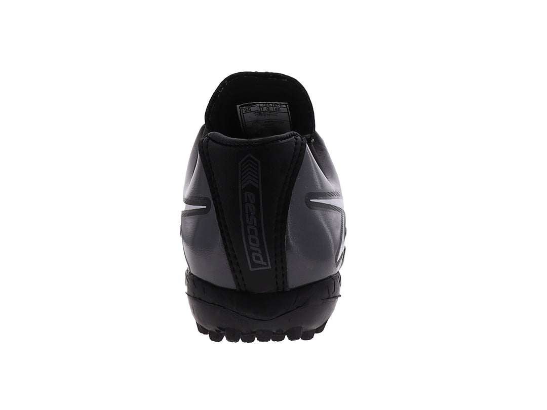 Zapato de fútbol EESCORD color negro con detalles en blanco y gris, diseñado para canchas sintéticas.
