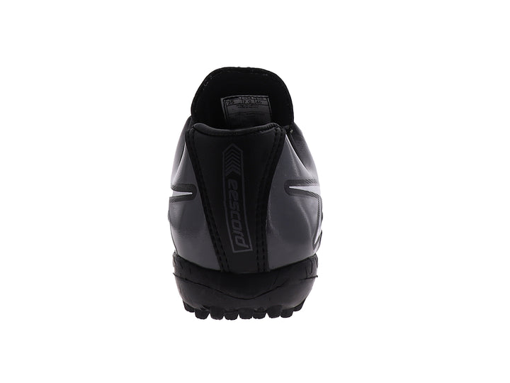 Zapato de fútbol EESCORD color negro con detalles en blanco y gris, diseñado para canchas sintéticas.