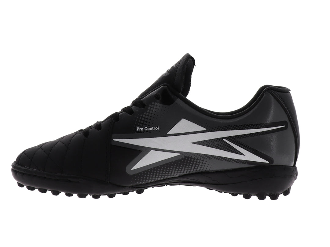 Zapato de fútbol EESCORD color negro con detalles en blanco y gris, diseñado para canchas sintéticas.