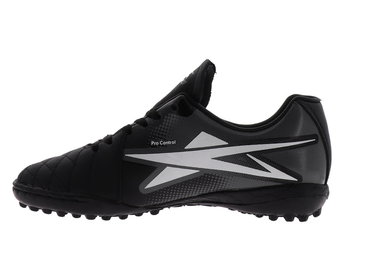 Zapato de fútbol EESCORD color negro con detalles en blanco y gris, diseñado para canchas sintéticas.