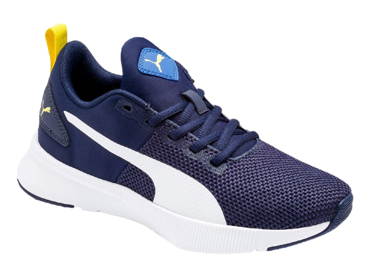 Tenis deportivos PUMA color azul marino con franja y suela blanca y detalles en amarillo.