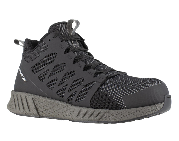 Tenis de seguridad Reebok en color negro con puntera y suela en gris oscuro.
