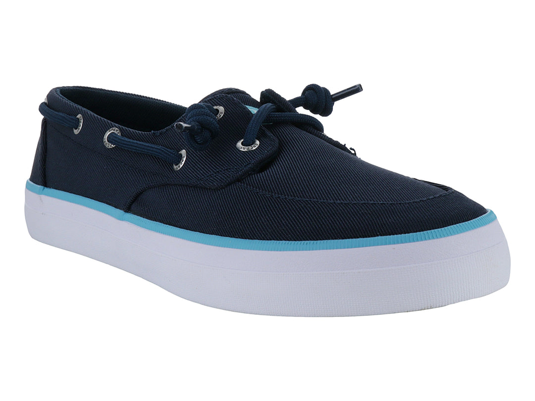 Zapato náutico Sperry azul marino con suela blanca y una franja decorativa en azul claro.