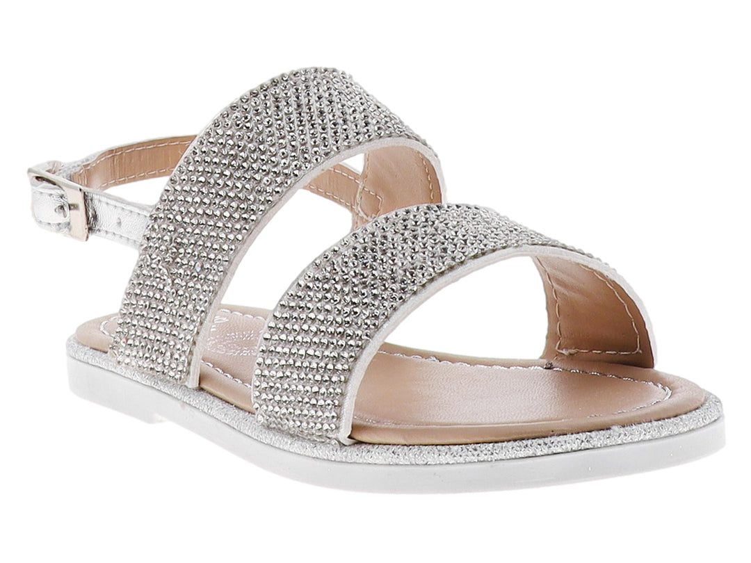 Sandalia plateada para niña con correas decoradas con brillantes y suela blanca.