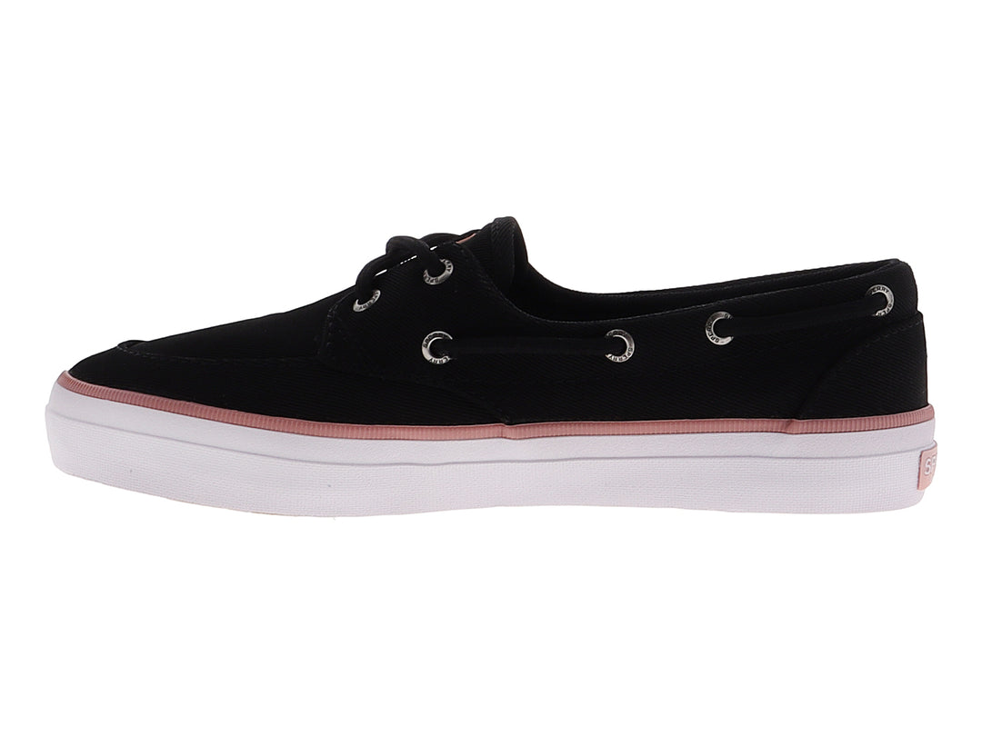 Zapato náutico Sperry de tela negra con franja rosa y suela blanca.