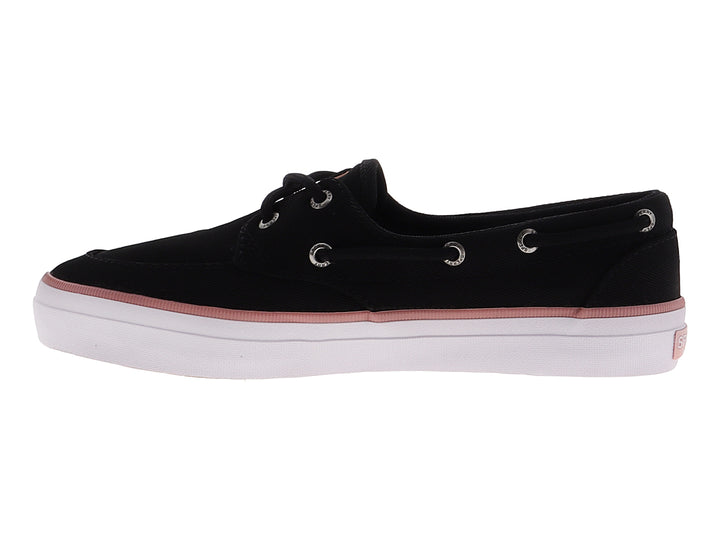 Zapato náutico Sperry de tela negra con franja rosa y suela blanca.