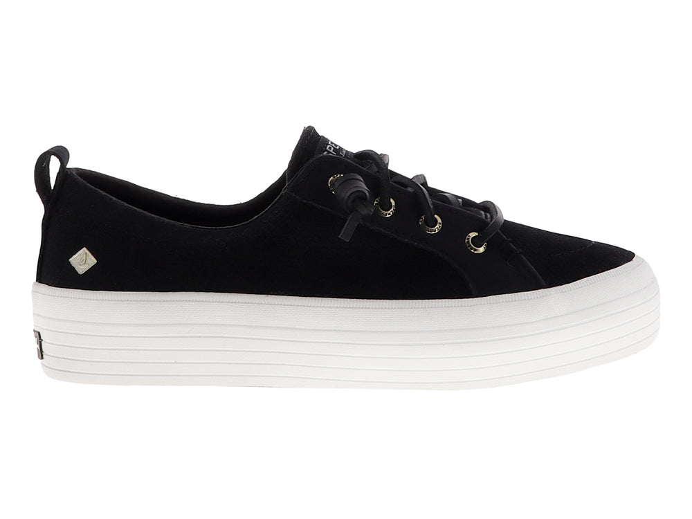 Tenis SPERRY negros con suela de plataforma blanca y cordones negros.