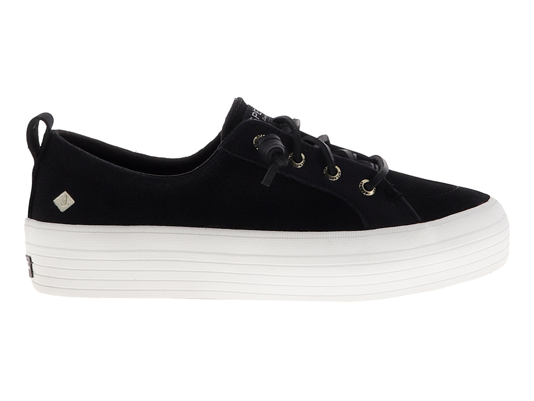 Tenis SPERRY negros con suela de plataforma blanca y cordones negros.