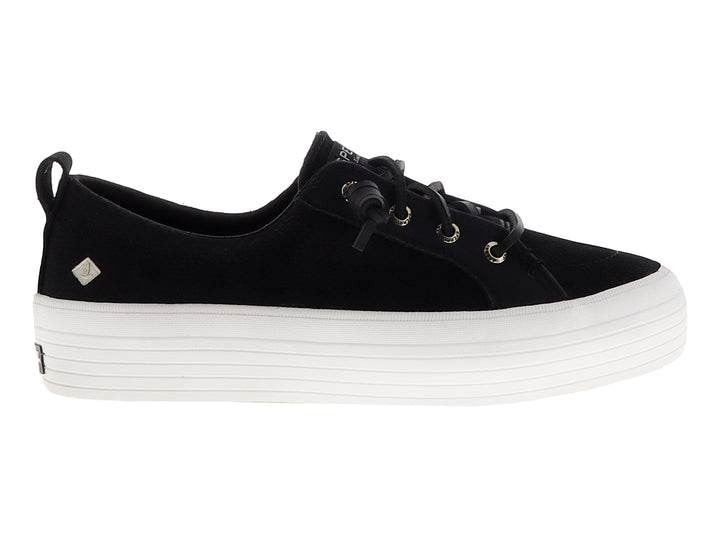 Tenis SPERRY negros con suela de plataforma blanca y cordones negros.