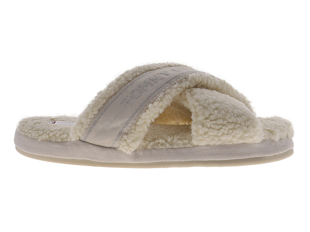 Pantufla amarilla de Tommy Hilfiger con textura de peluche y banda superior con logotipo.