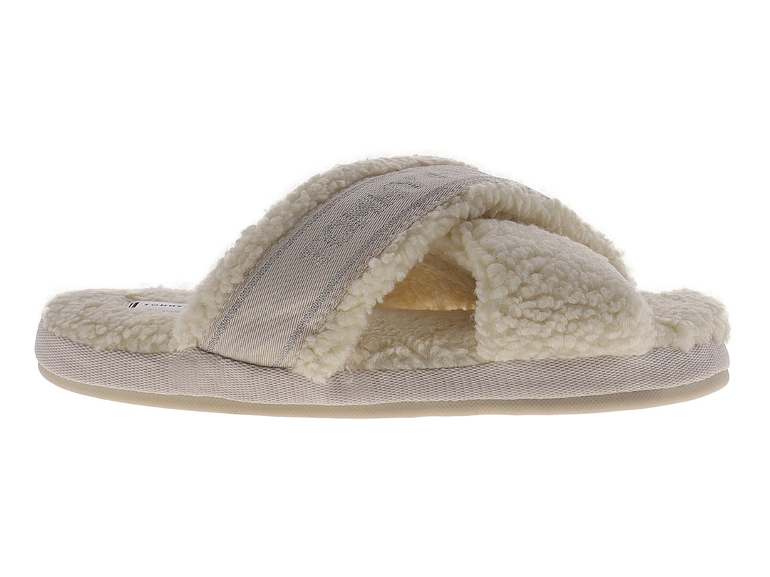 Pantufla amarilla de Tommy Hilfiger con textura de peluche y banda superior con logotipo.