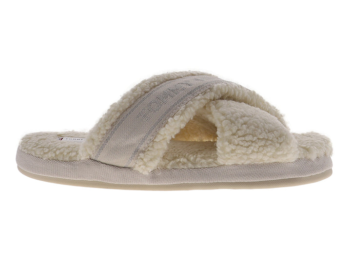 Pantufla amarilla de Tommy Hilfiger con textura de peluche y banda superior con logotipo.
