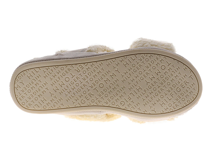 Pantufla amarilla de Tommy Hilfiger con textura de peluche y banda superior con logotipo.