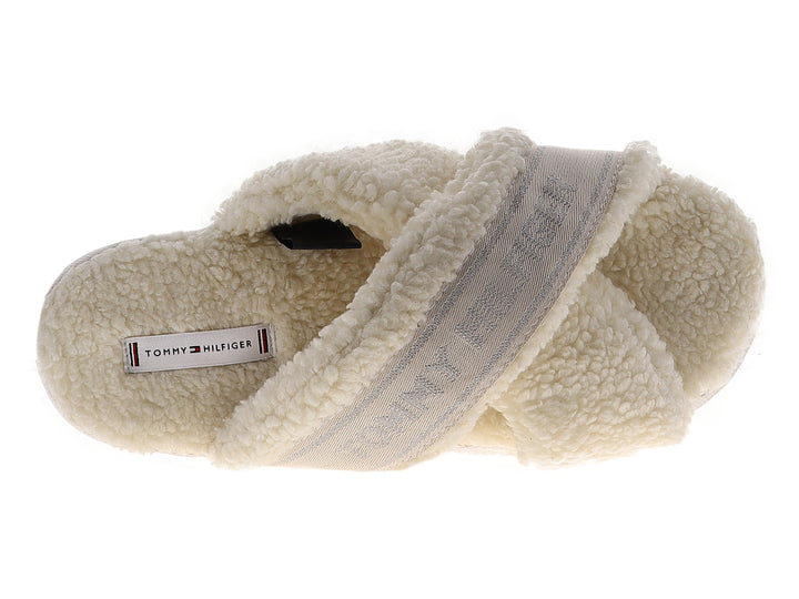 Pantufla amarilla de Tommy Hilfiger con textura de peluche y banda superior con logotipo.