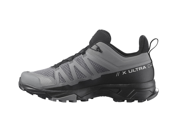 Zapato de senderismo Salomon X Ultra 4 en colores gris y negro con suela robusta.