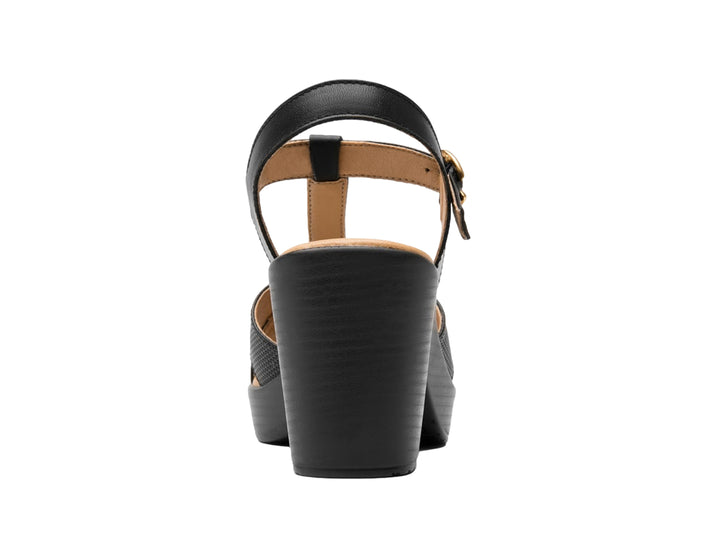 Sandalia Flexi color negro para mujer con tacón cuadrado, plataforma y correas cruzadas perforadas.