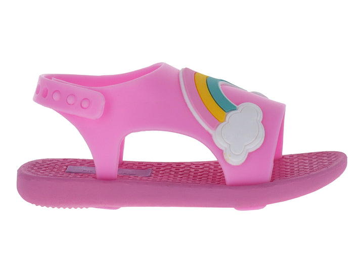 Sandalia infantil color rosa con detalle de arcoíris y nube blanca en la parte superior.