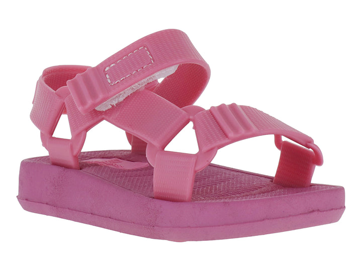 Sandalias infantiles color rosa Barbie con tiras ajustables de velcro y suela plana.