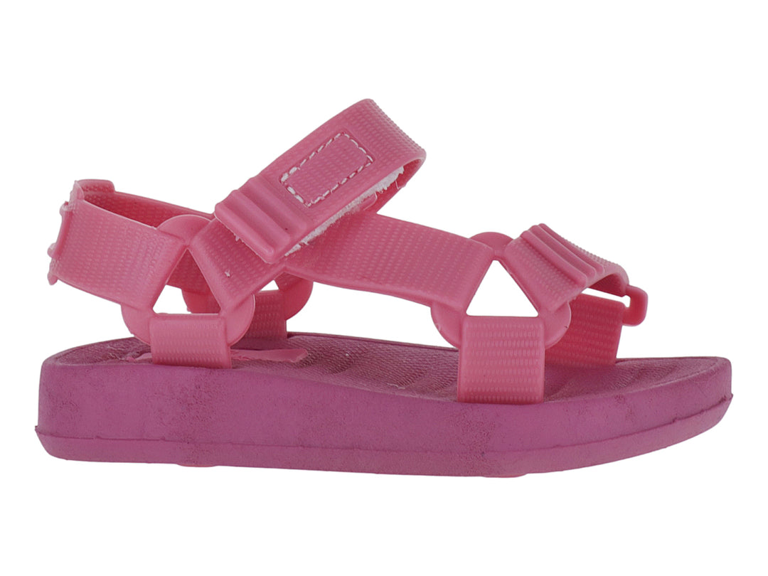 Sandalias infantiles color rosa Barbie con tiras ajustables de velcro y suela plana.