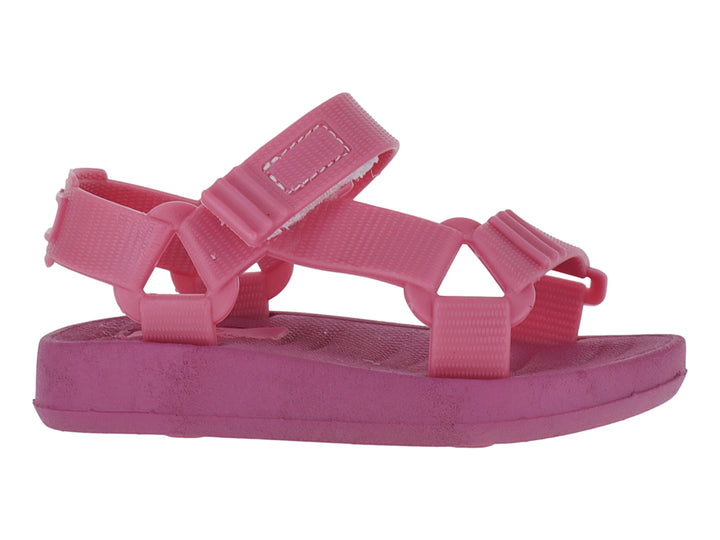 Sandalias infantiles color rosa Barbie con tiras ajustables de velcro y suela plana.