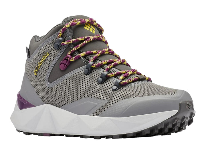 Zapato de senderismo Columbia color gris oscuro con detalles en amarillo y suela blanca.