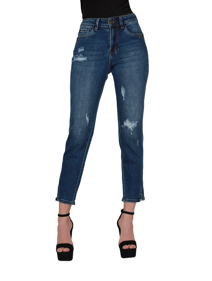 Pantalones de mezclilla azul estilo stone con detalles de destrucción y corte ajustado para mujer.