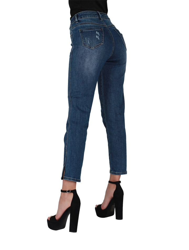 Pantalones de mezclilla azul estilo stone con detalles de destrucción y corte ajustado para mujer.