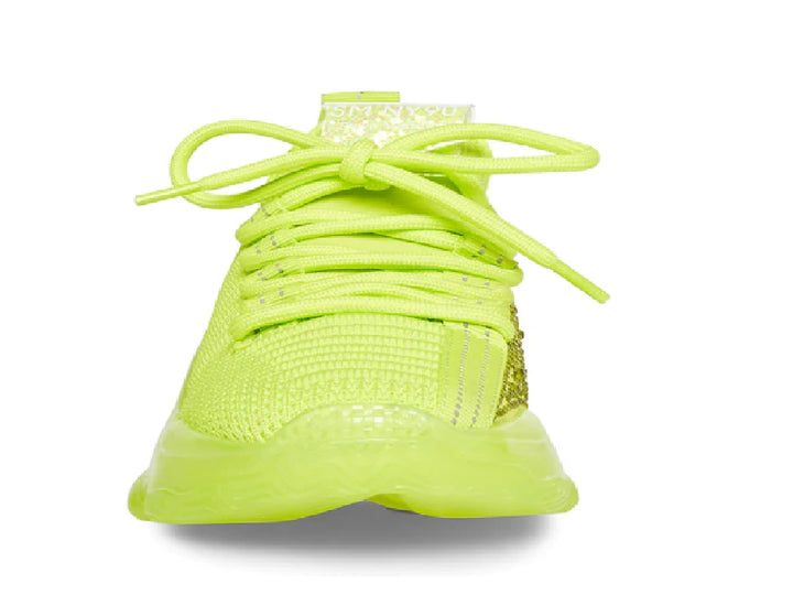 Tenis deportivos infantiles color amarillo neón con suela robusta y detalles brillantes laterales.