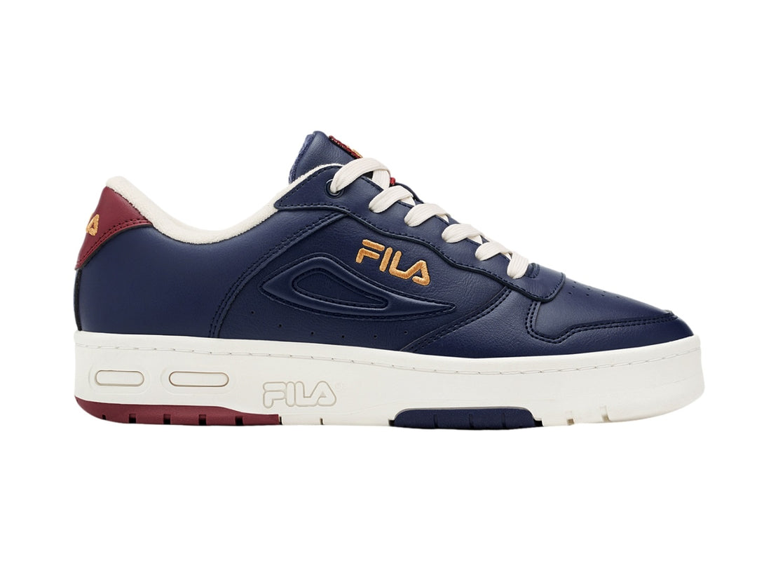 Tenis FILA LNX-100 color azul marino con suela blanca y detalles en color vino.