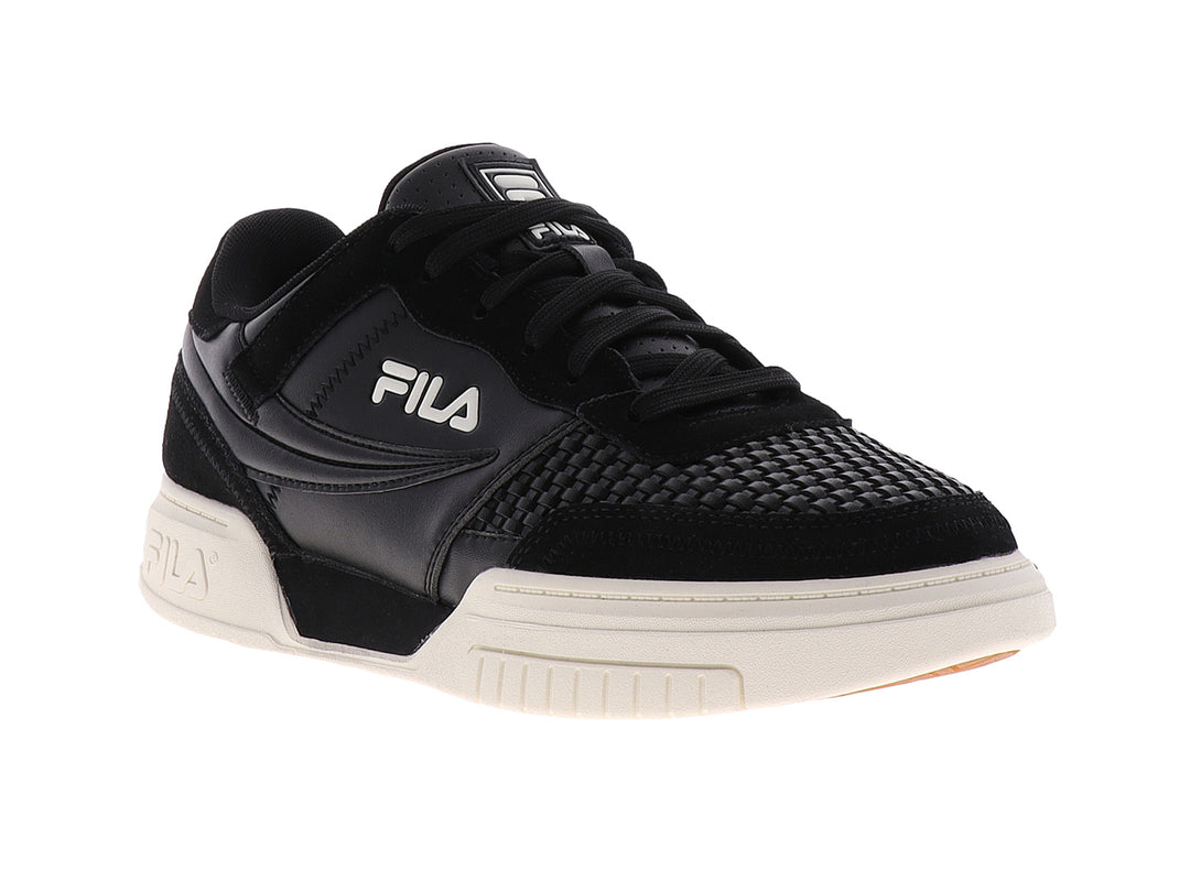 Tenis FILA color negro con suela color crema, diseño deportivo casual.