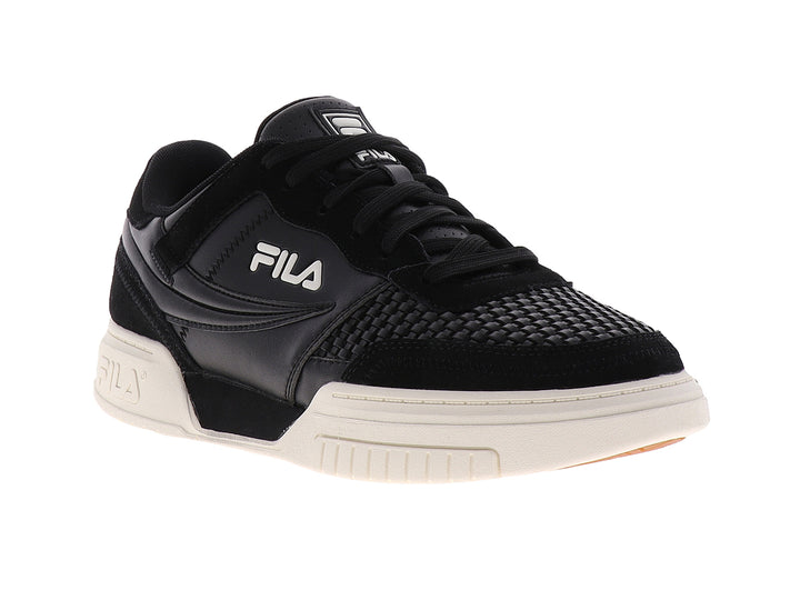 Tenis FILA color negro con suela color crema, diseño deportivo casual.